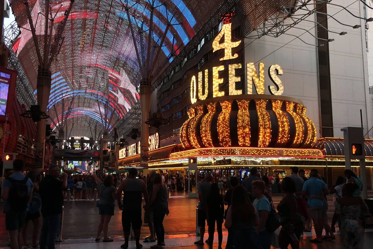 Crowds under the lit canopy of the Fremont Street Experience downtown